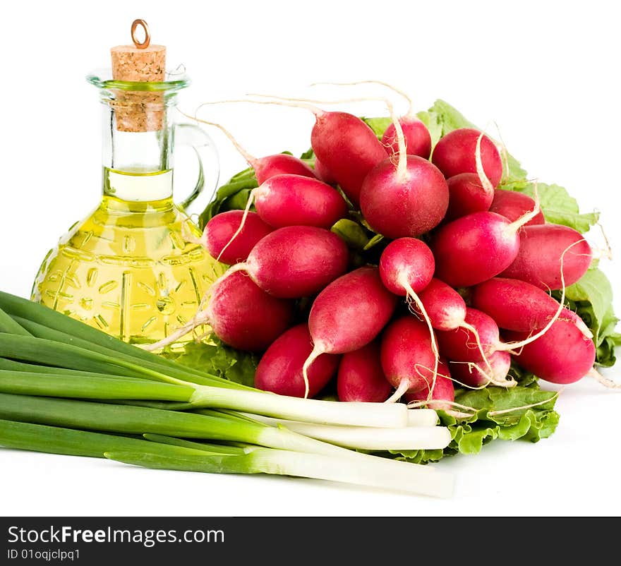 Green vegetables and  bottle of oil