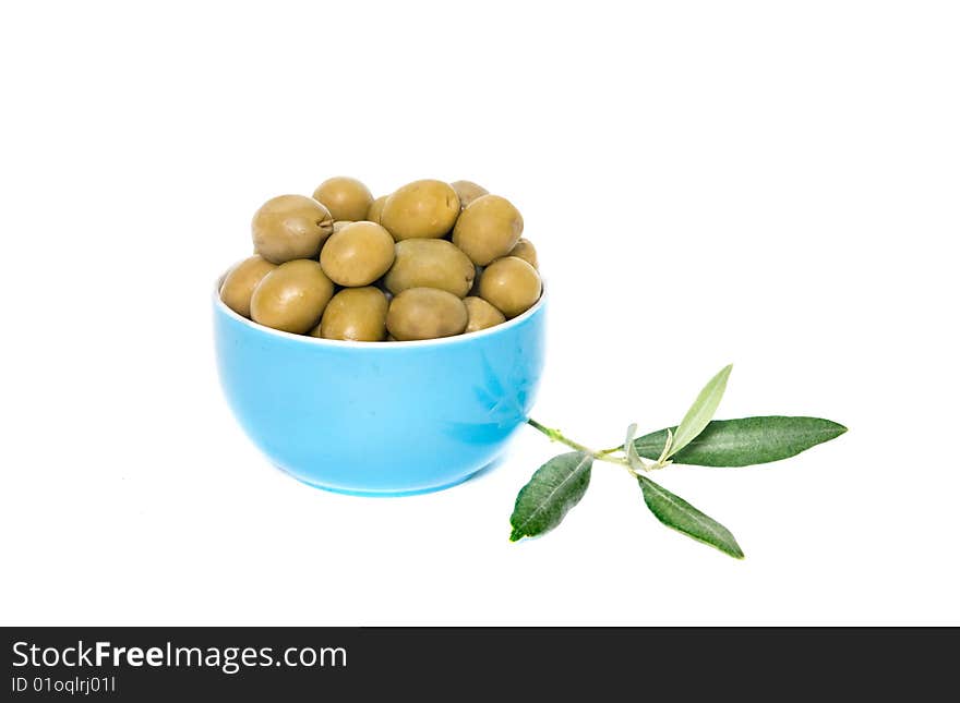 Blue cup full of green olives