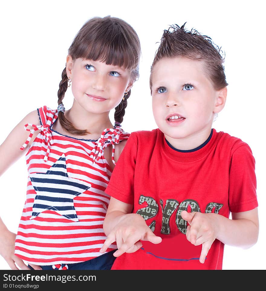 Cute blue-eyed boy and girl posing in the studio, isolated on white background