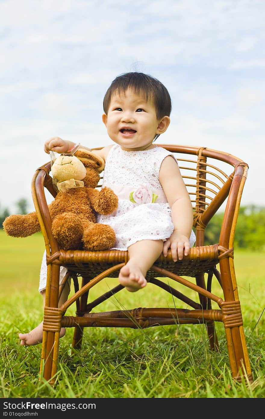 Portrait Of A Infant Girl Outdoor In The Park