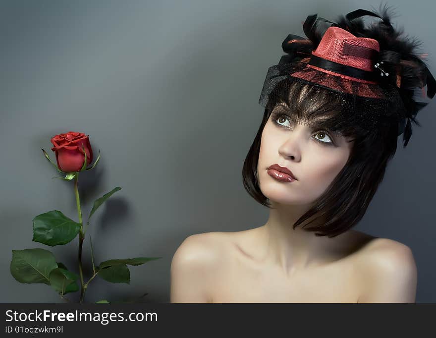 Girl in the red cap with the flower. Girl in the red cap with the flower.