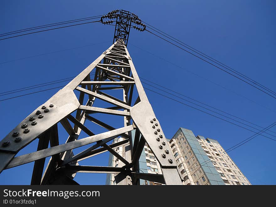 Column, support, transmission line on  background of  blue sky