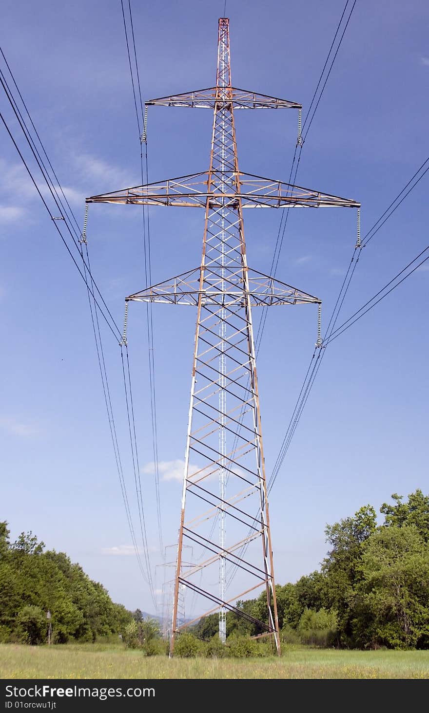 High power electricity lines against the blue sky. High power electricity lines against the blue sky.