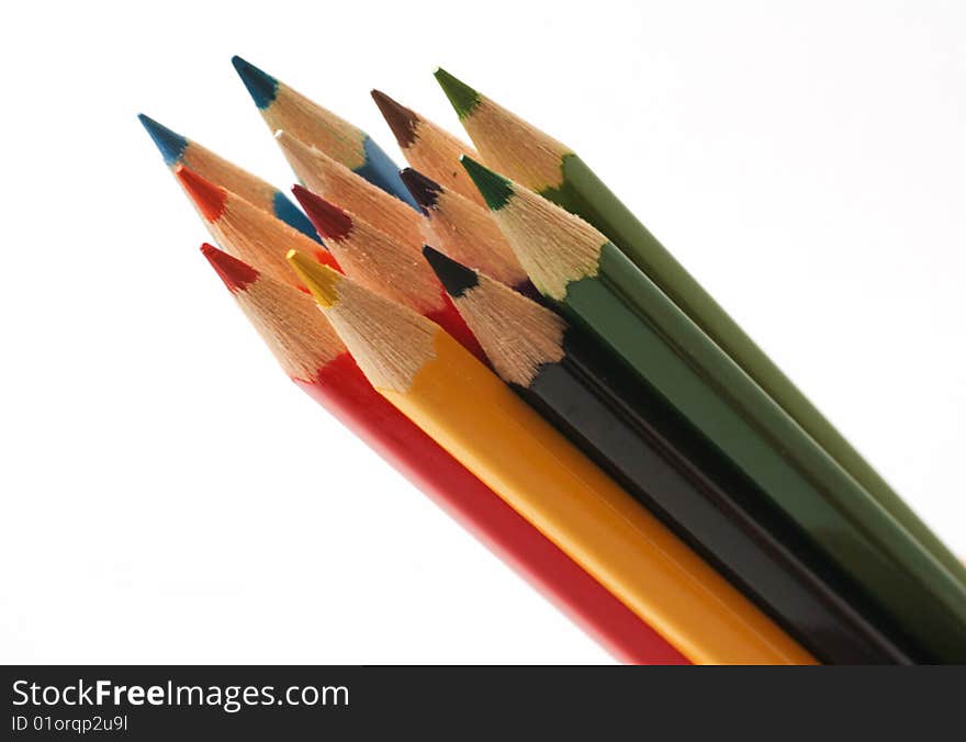 Colourful pencils on white background