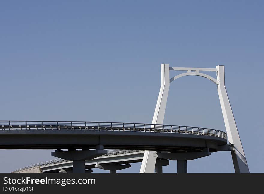 Plot of a modern highway to the blue sky background. Plot of a modern highway to the blue sky background