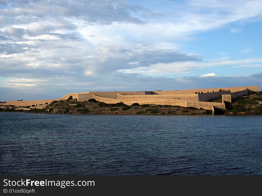 Wall of a fortress on a coast of Menorca in Balearic islands