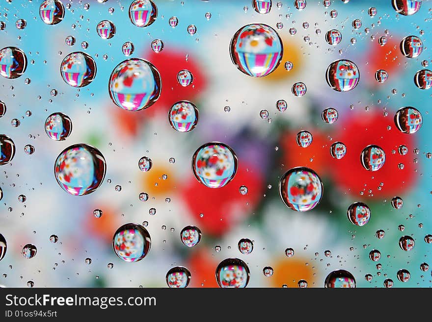 Dripped on glass varicoloured.Abstract textured background. Dripped on glass varicoloured.Abstract textured background.