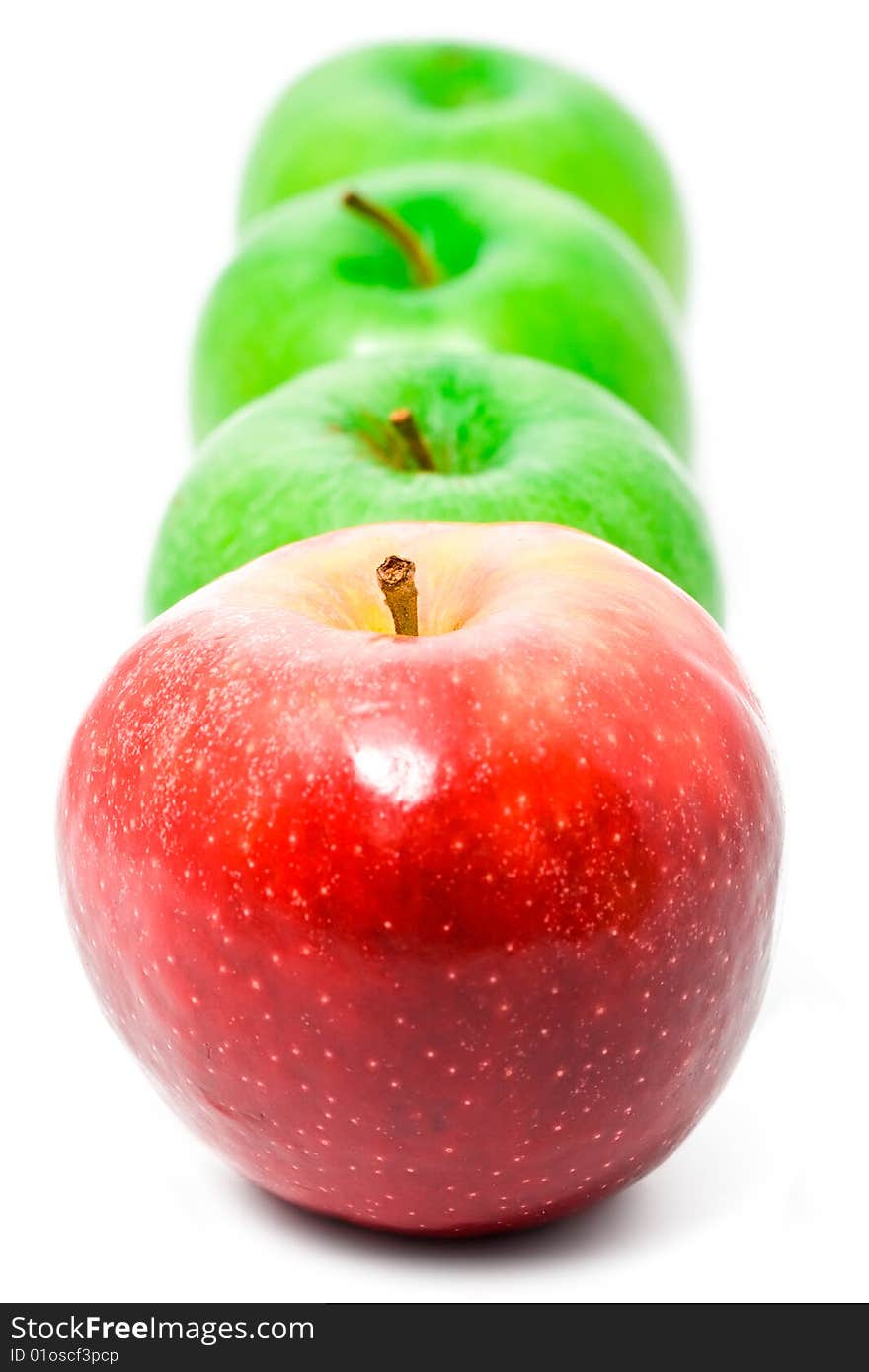 Red and green apples on white