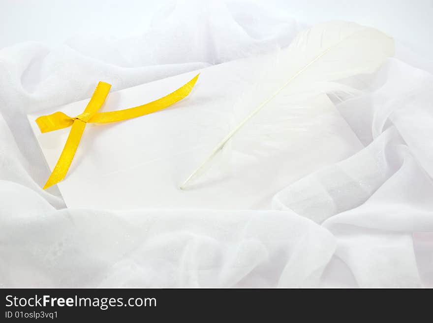 Blank Note, Yellow Ribbon And Feather