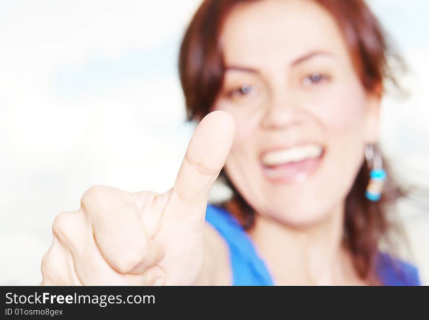 Happy young woman over white background. Isolated image