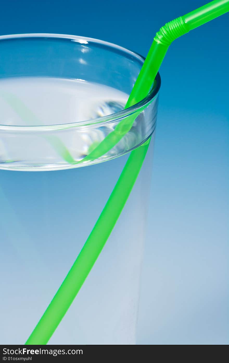 Glass of water on blue gradient background