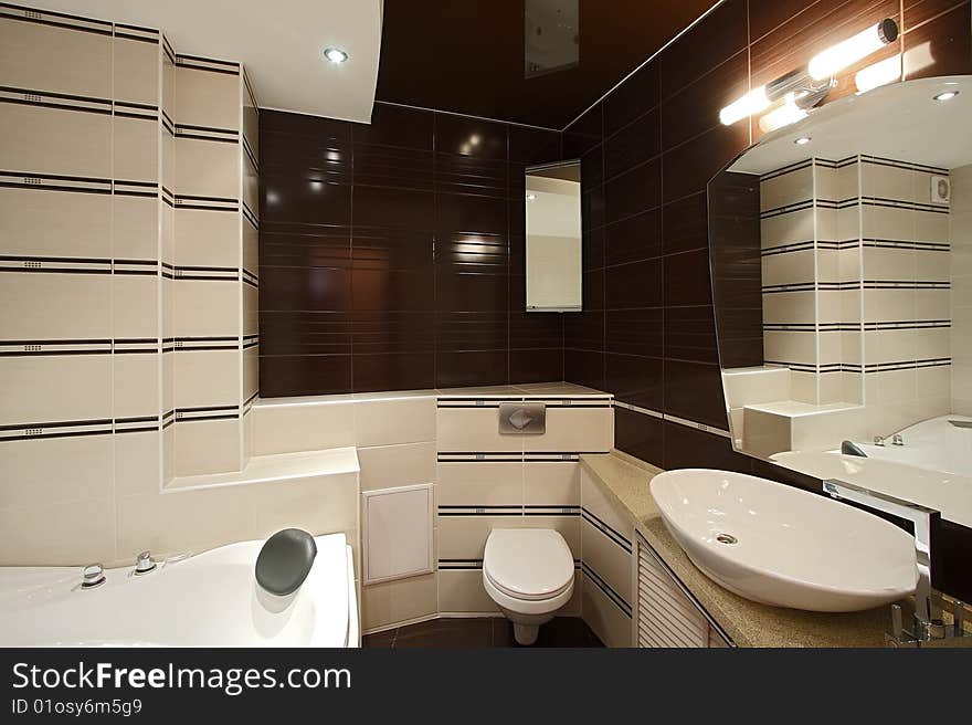 The beautiful modern bathroom finished with a tile