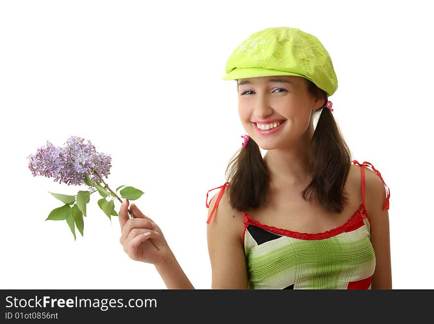 The girl in a green cap with a lilac bouquet