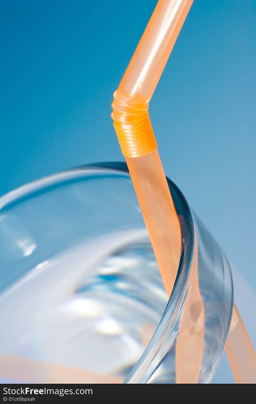 Glass of water on blue gradient background