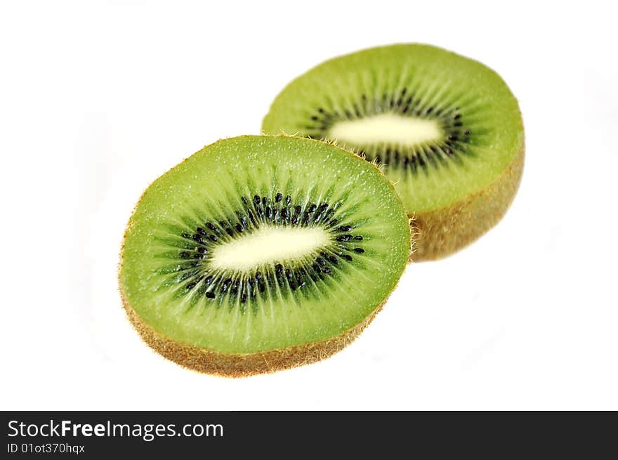 Slices of  kiwi isolated over white. Slices of  kiwi isolated over white.