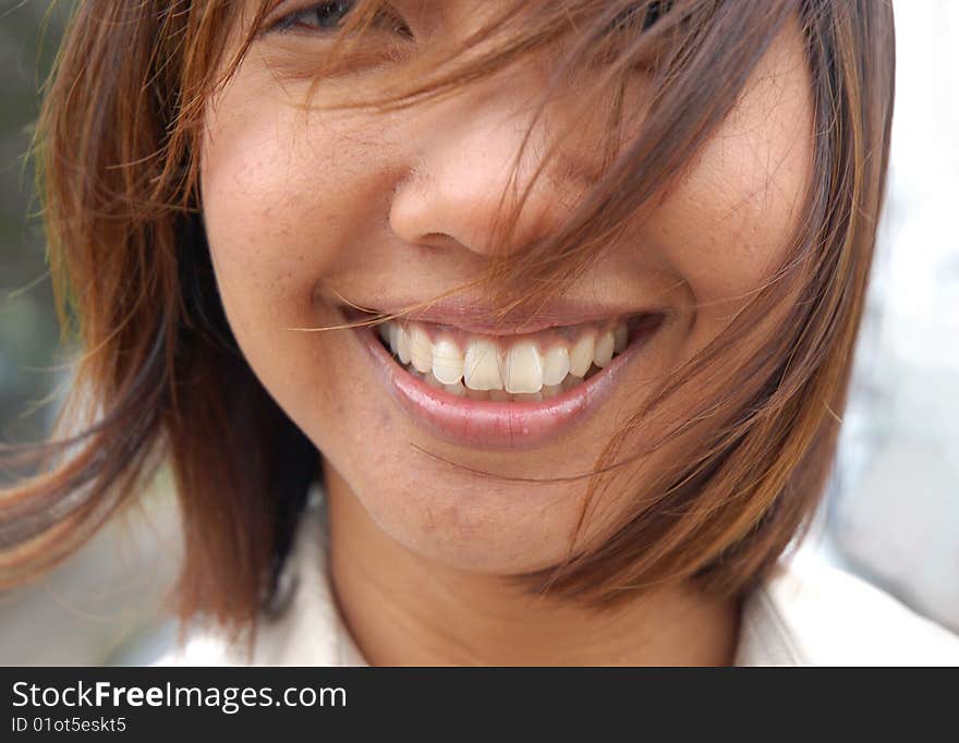 Woman of Malay descent smiling. Woman of Malay descent smiling.