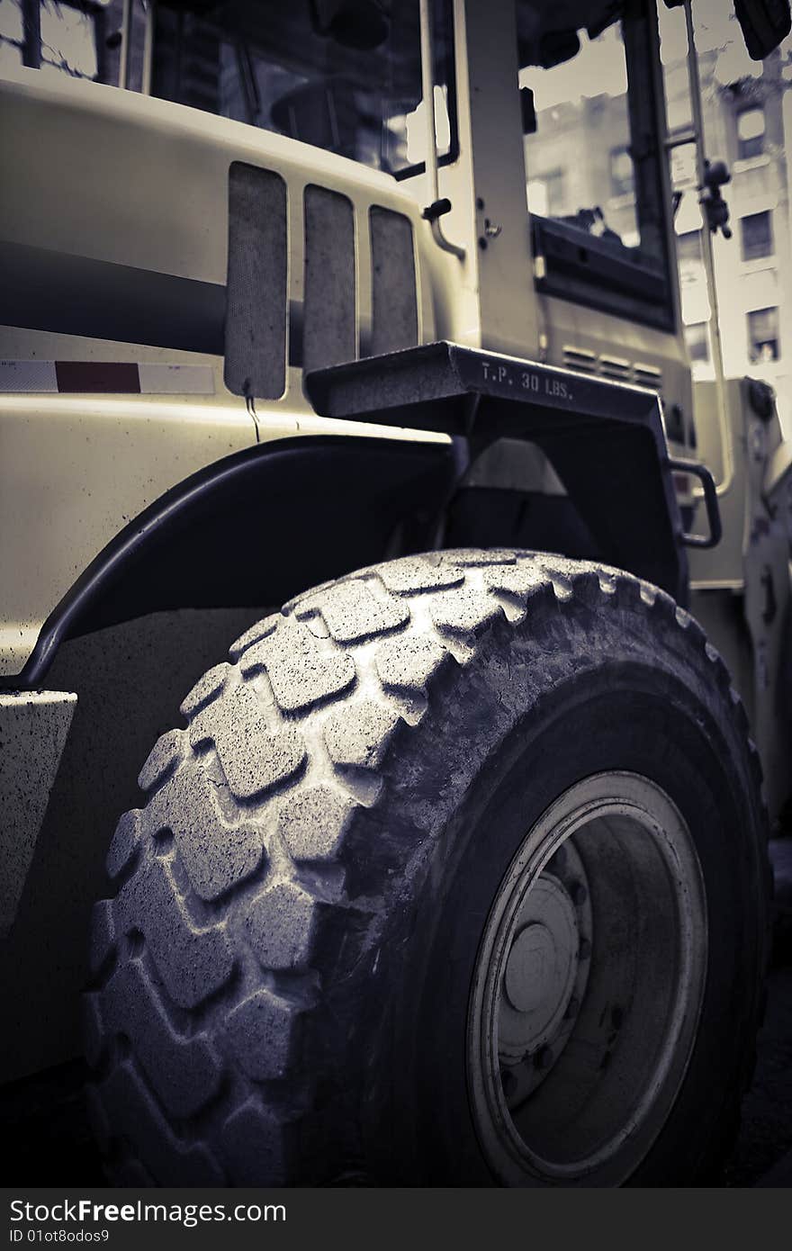 Big wheels of a loader on Job site. Big wheels of a loader on Job site