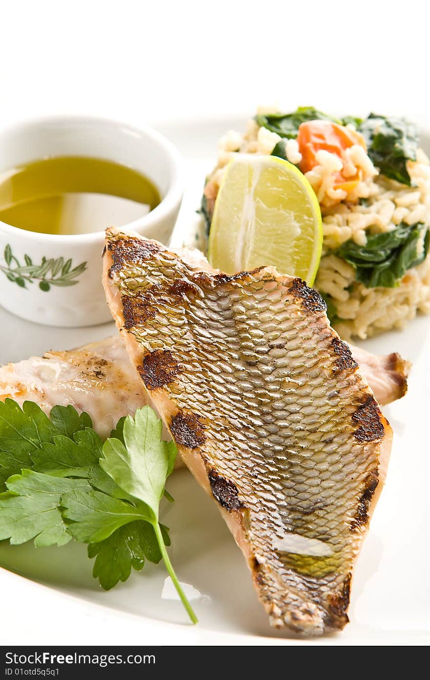 Grilled fish with rice and lemon sauce