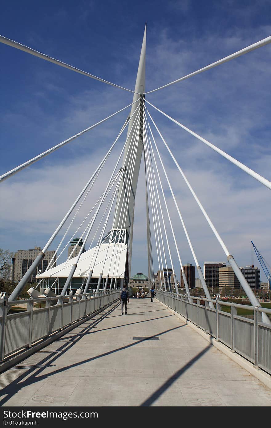 A white modern cable pedestrian bridge.