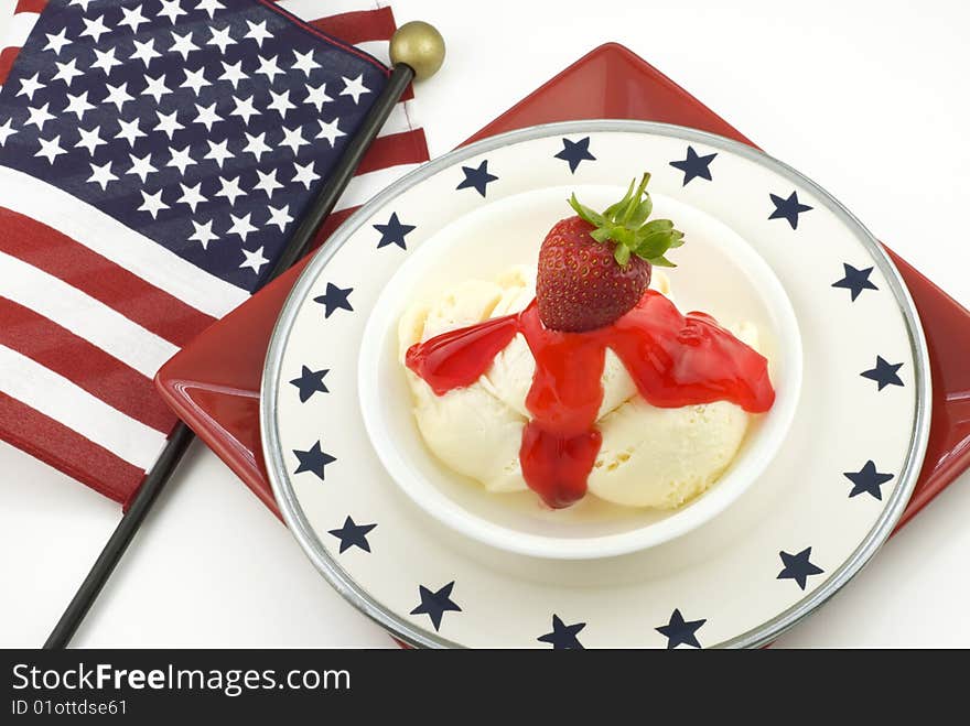 A bowl of vanilla ice cream with strawberry topping and flag background, horizontal with copy space. A bowl of vanilla ice cream with strawberry topping and flag background, horizontal with copy space