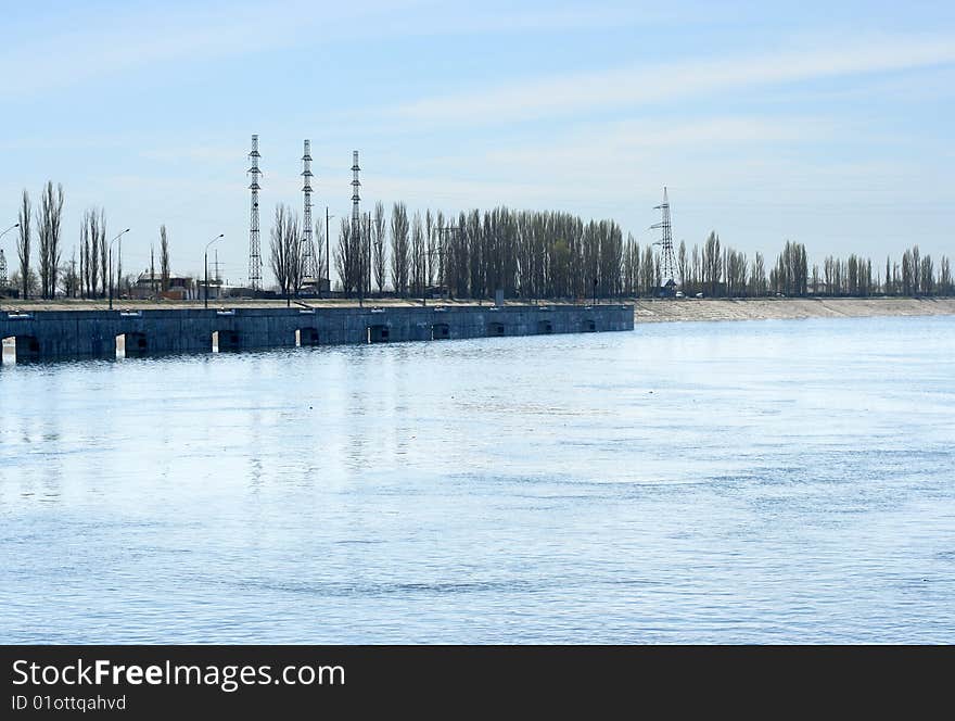 Tempestuous water river beside city. Tempestuous water river beside city