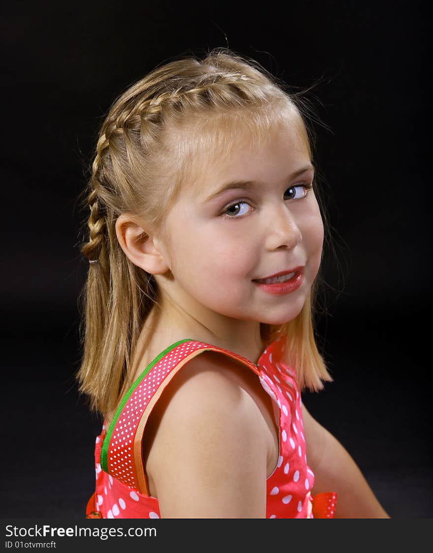 A childs portrait on a black background. A childs portrait on a black background