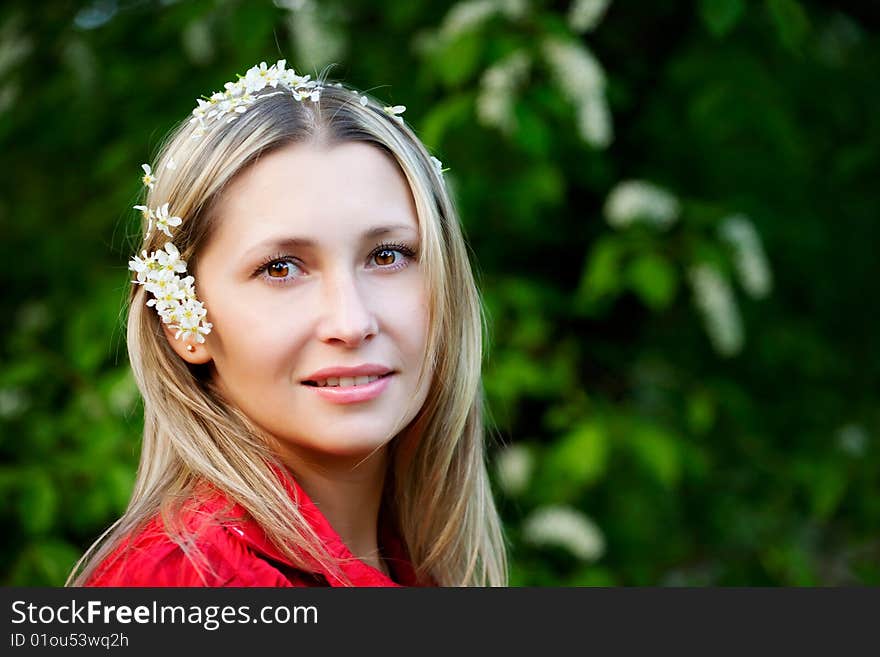 Portrait of woman in red dress in nature