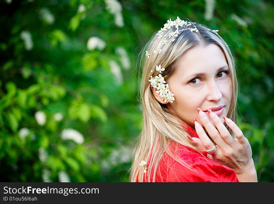 Portrait of woman in red dress in nature