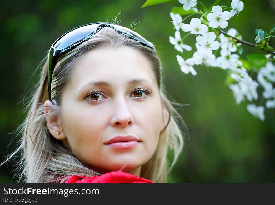 Portrait of woman in red dress in nature