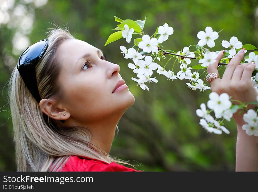 Portrait of woman in red dress in nature