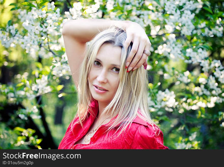 Portrait of woman in red dress in nature