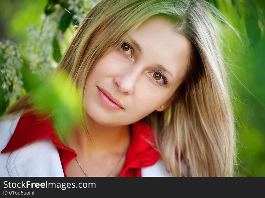 Portrait of woman in red dress in nature