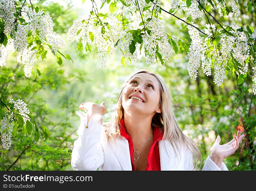 Portrait of woman in red dress in nature