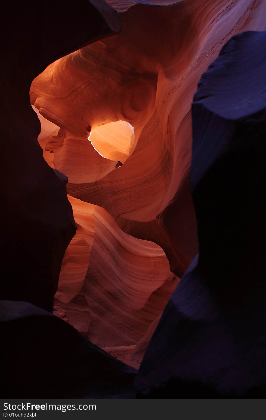 Antelope Canyon- hole in canyon wall portrait. Antelope Canyon- hole in canyon wall portrait