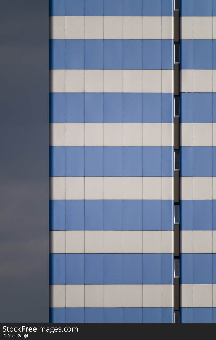 A skyscraper in the blue sky