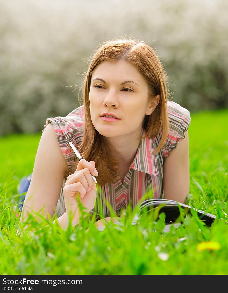 Pretty student studying outdoors