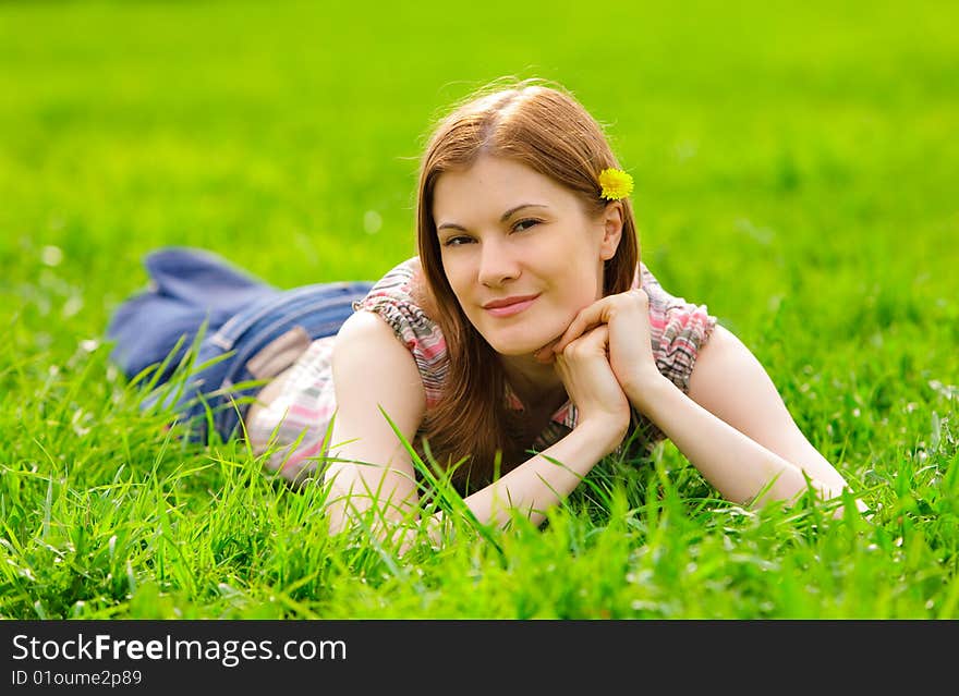 Pretty smiling girl relaxing outdoors. Pretty smiling girl relaxing outdoors