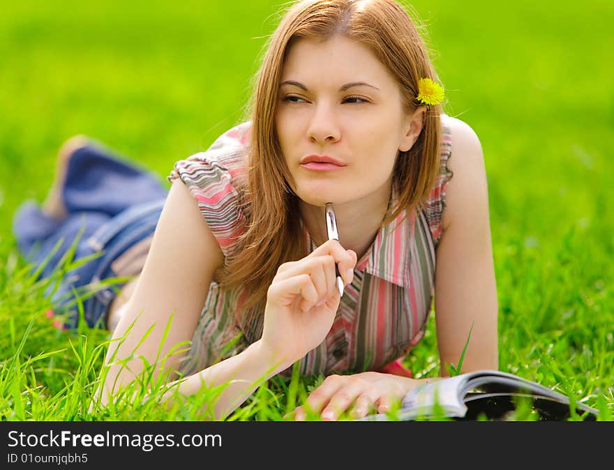 Pretty serious girl studying outdoors. Pretty serious girl studying outdoors