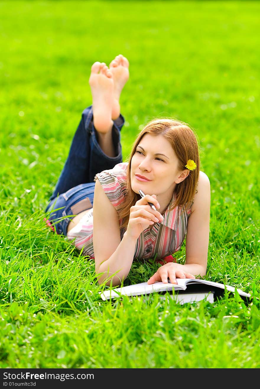 Pretty serious student studying outdoors. Pretty serious student studying outdoors