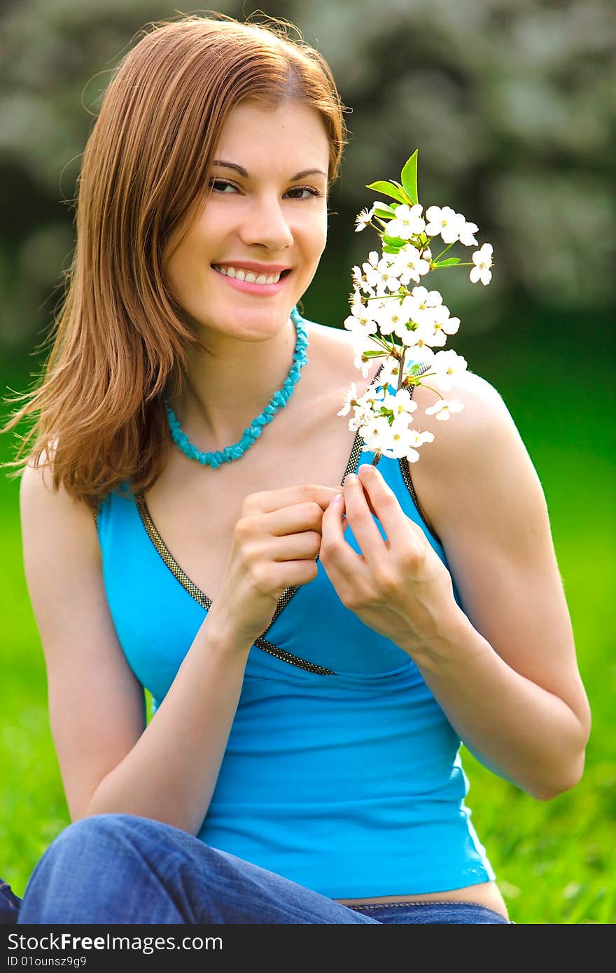 Beautiful girl with a flower outdoors