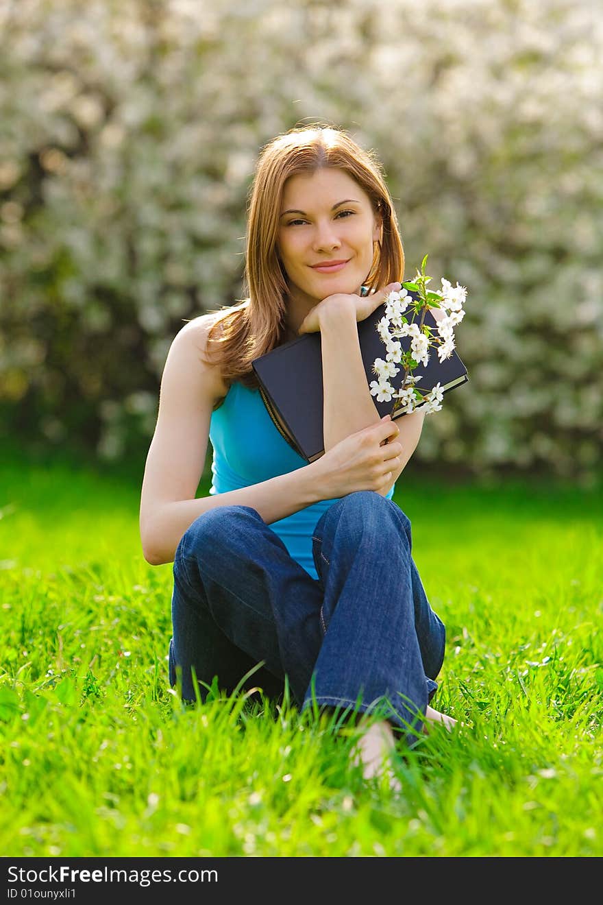 Nice girl with a book outdoors. Nice girl with a book outdoors