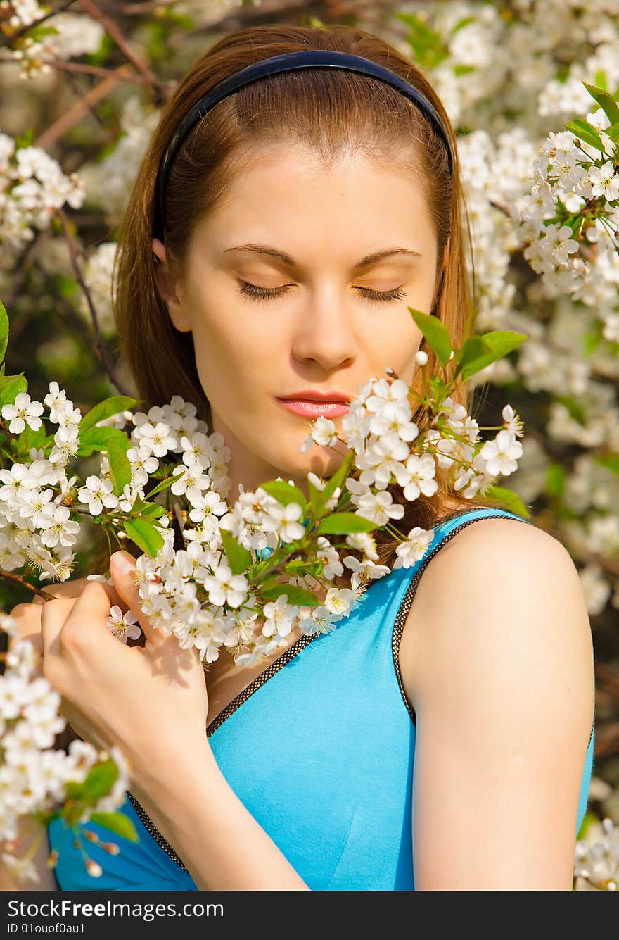 Beautiful girl with flowers relaxing outdoors. Beautiful girl with flowers relaxing outdoors