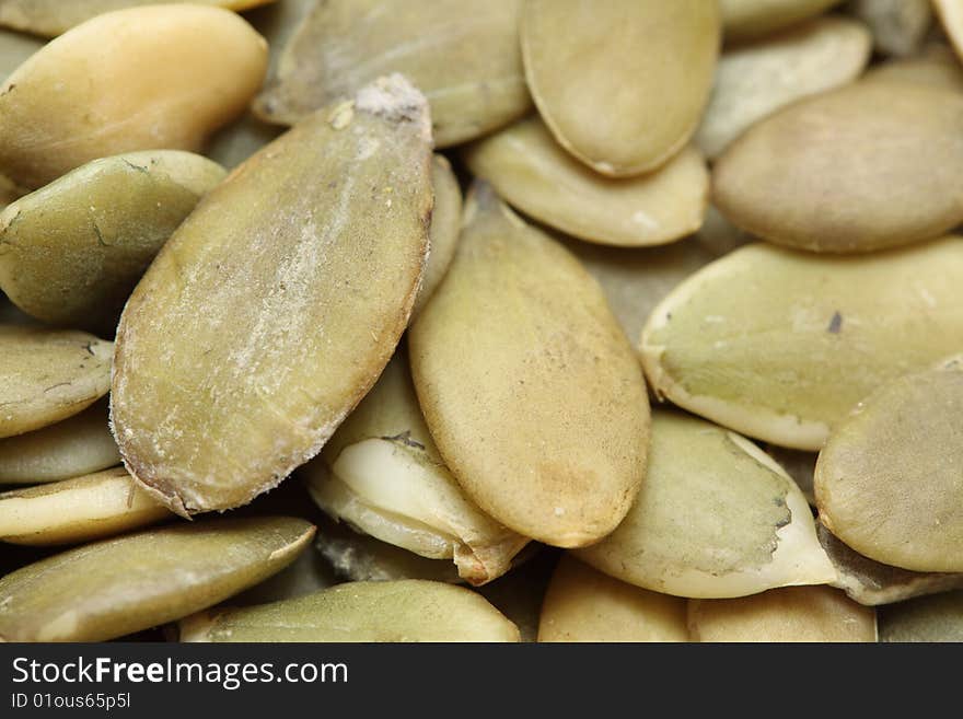 A macro shot of dried pumpkin seeds. A macro shot of dried pumpkin seeds.