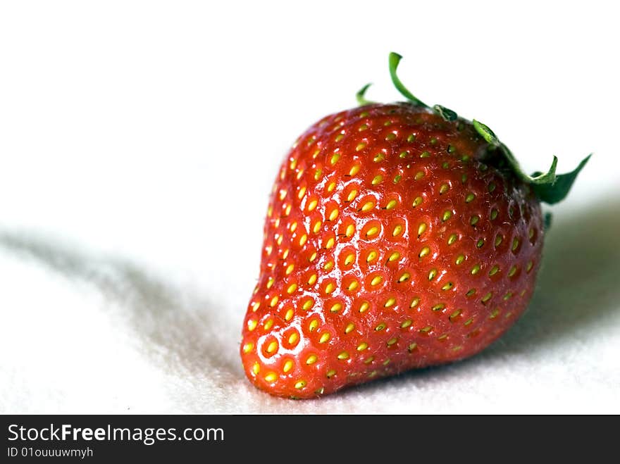 Red strawberry against a white background