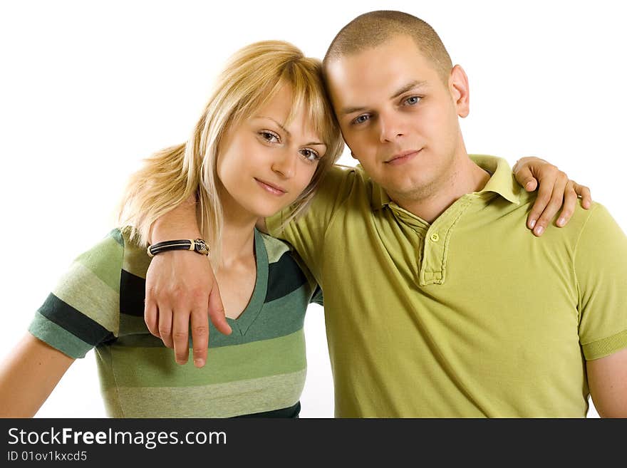 Embraced young couple over white background