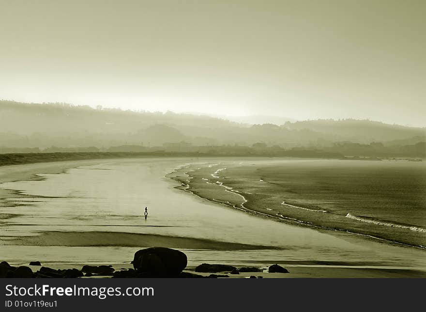 Landscape of the beach with silhouette of person, loneliness concept