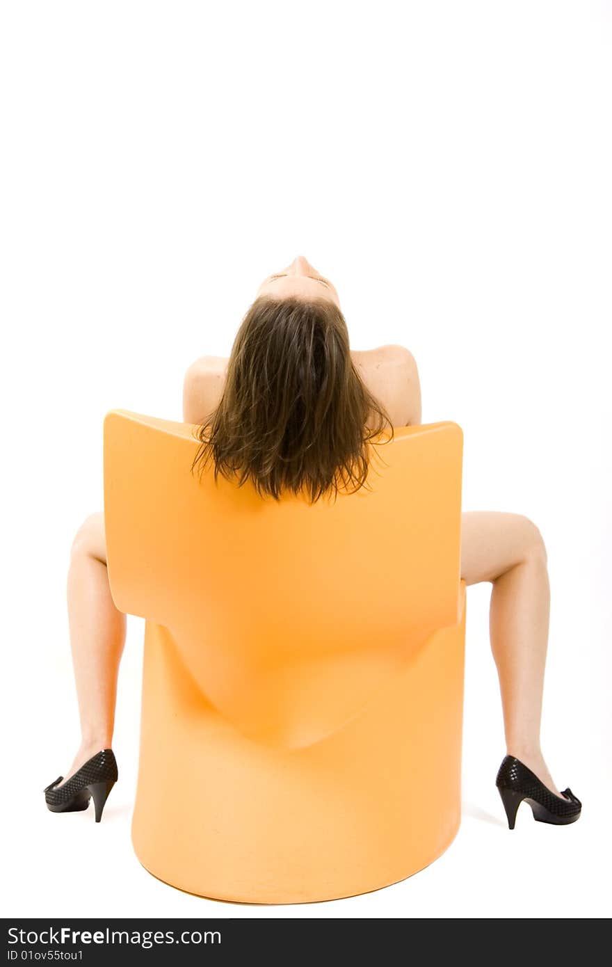 Picture of a woman on a chair, back view