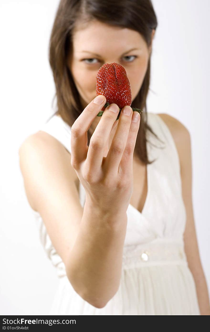 Woman holding a strawberry