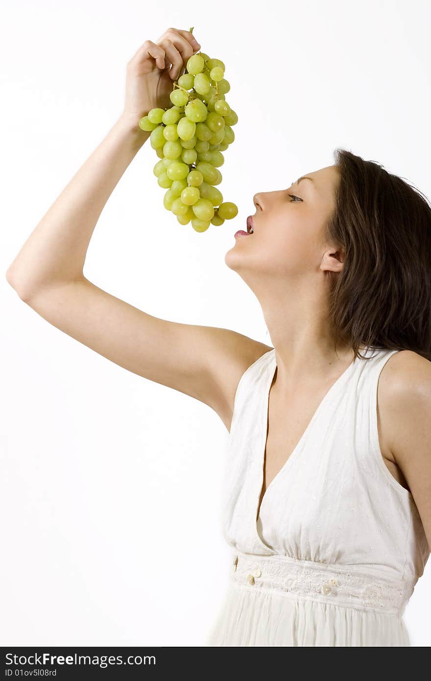 Woman tasting a grape