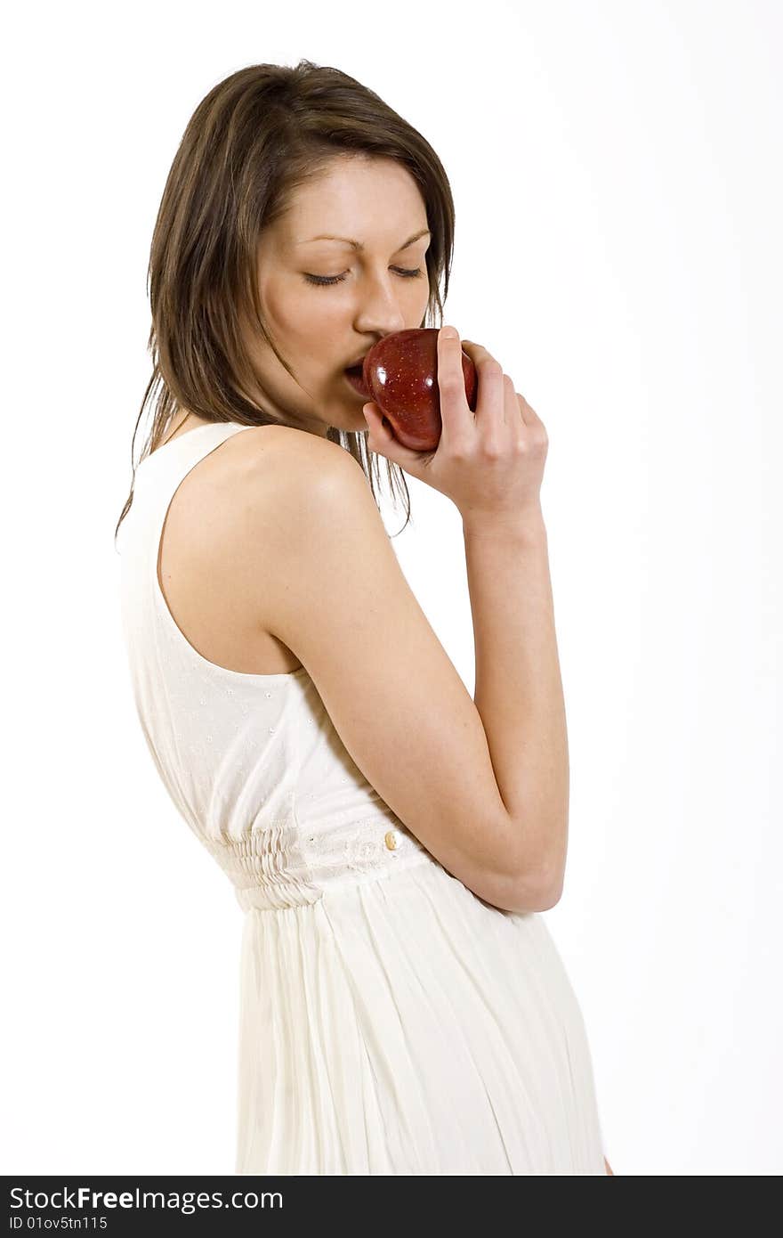 woman biting a red apple